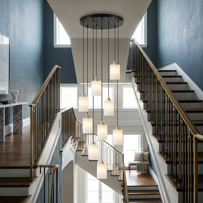 Carmeline Alabaster Cylinder Staircase Chandelier 9-light in a navy two-story stairwell