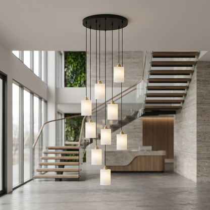 Carmeline Alabaster Cylinder Staircase Chandelier 9-light over a floating staircase in an office lobby