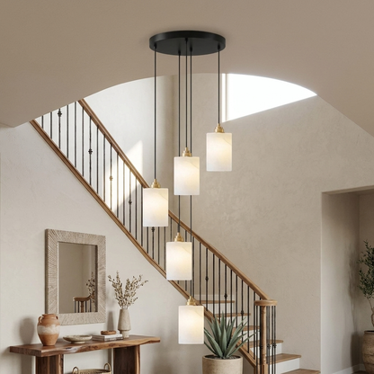 Carmeline Alabaster Cylinder Staircase Chandelier 5-light in a suburban curved-staircase foyer