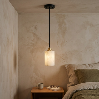 Carmeline Alabaster Cylinder Staircase Chandelier 1-light beside the bed in an apartment bedroom
