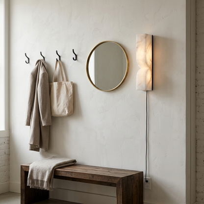 Cerise Carved Alabaster Plug In LED Wall Sconce 13.8 in. in black in a farmhouse mudroom entry