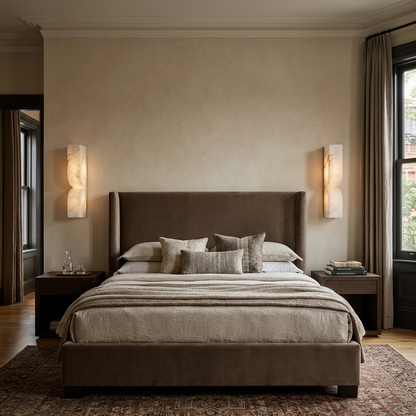 Chantal Solid Carved Alabaster LED Wall Sconce 13.8 in. in gold flanking the bed in a suburban bedroom