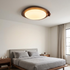 Zenaide Walnut Grain Low Profile LED Ceiling Light Model A in a modern bedroom